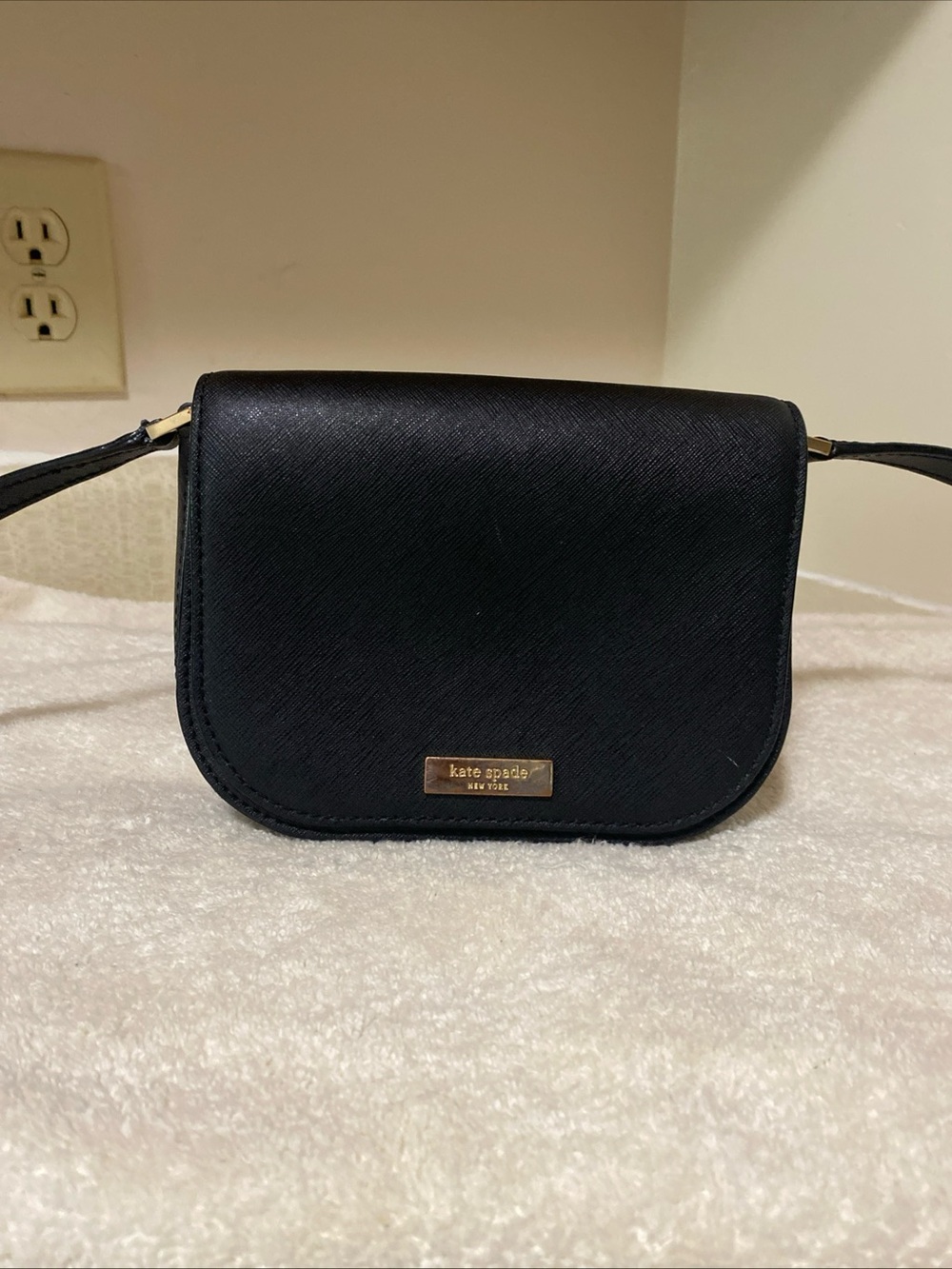 kate spade black crossbody with gold-tone plaque